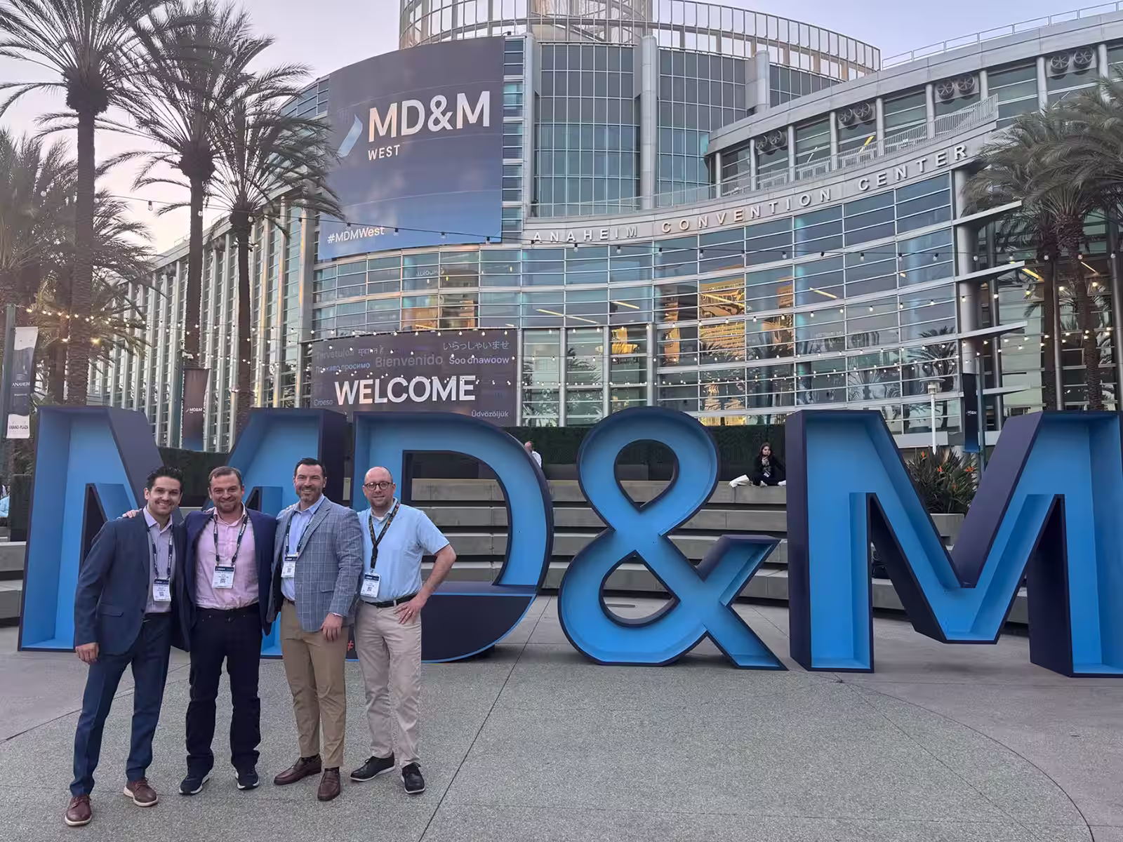 Global Interconnect team members meeting with attendees at a medical device industry tradeshow